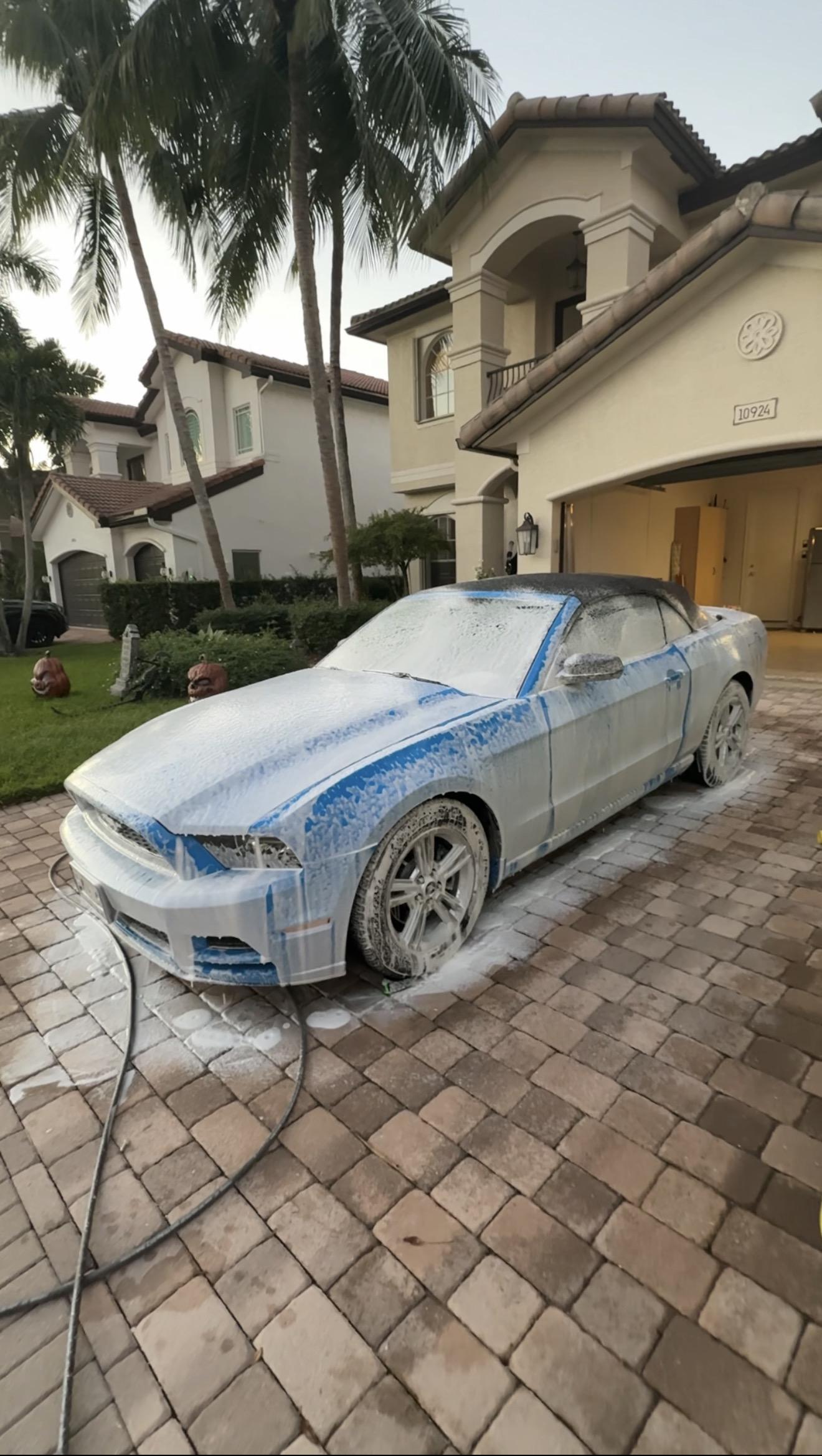 Foam cannon treatment covering full vehicle exterior — safe paint decontamination step