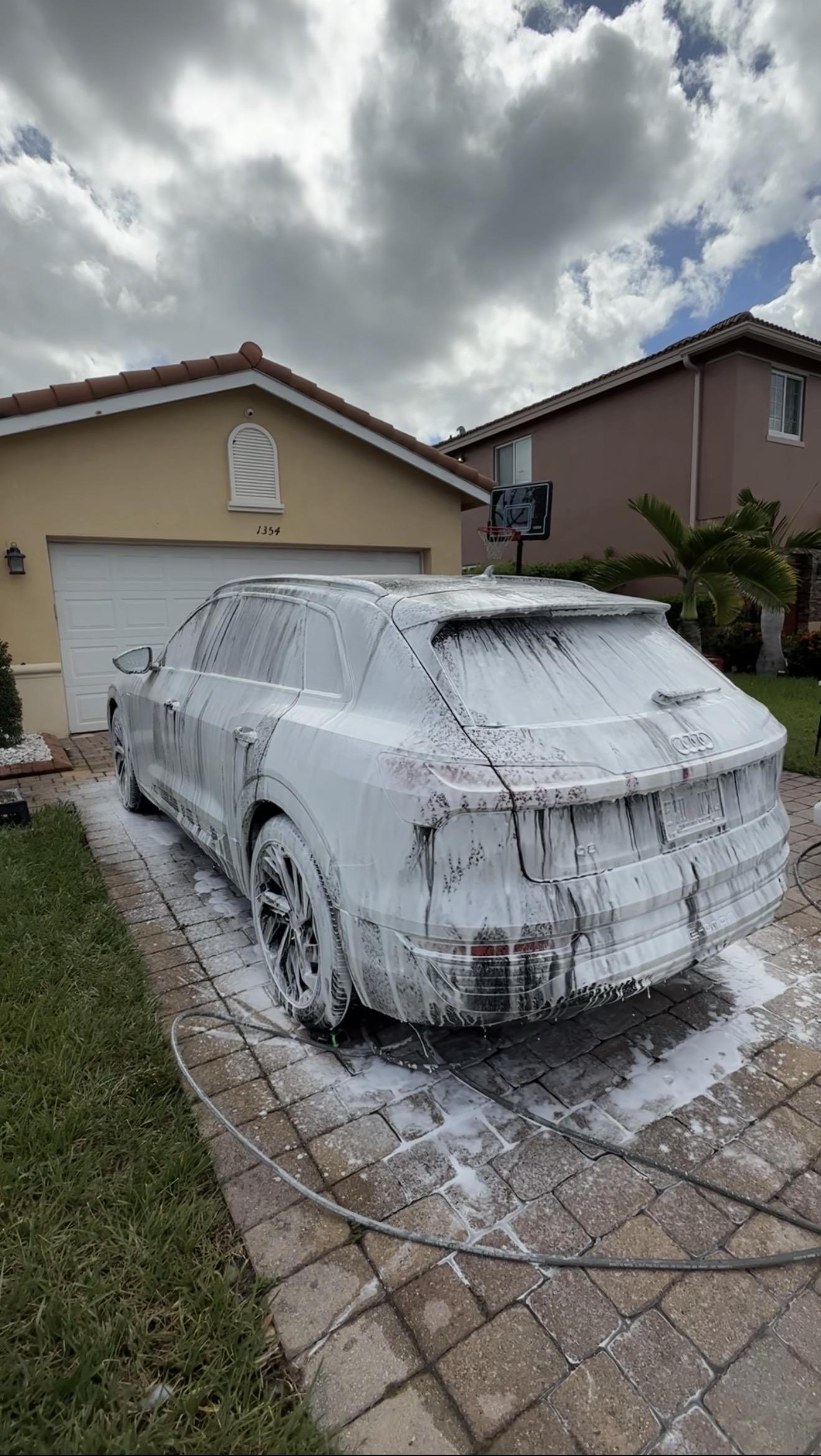 Thick pre-wash foam on SUV during professional detail — Teal Detailing process